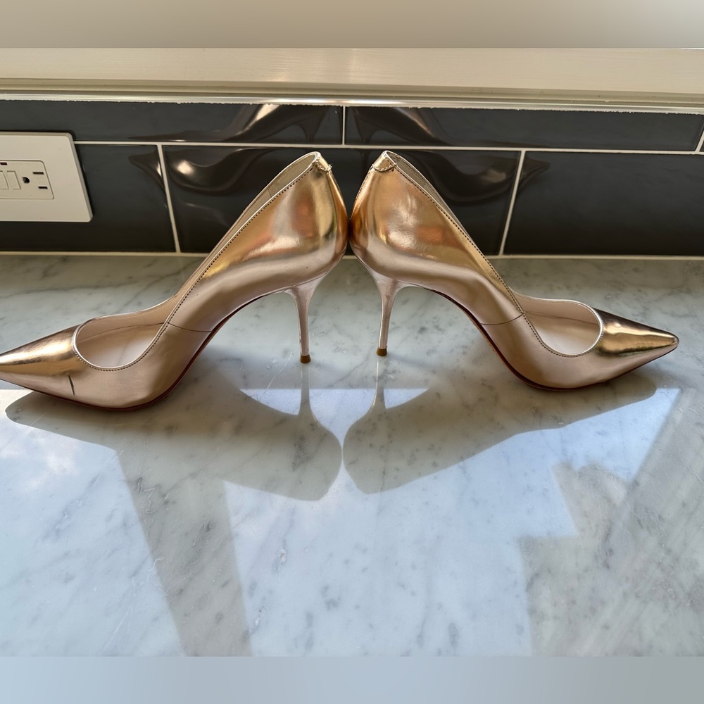 Elegant Gold Stiletto Heels by Sophia Webster.